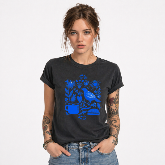 Person wearing a black t-shirt with blue graphic design on a white background
