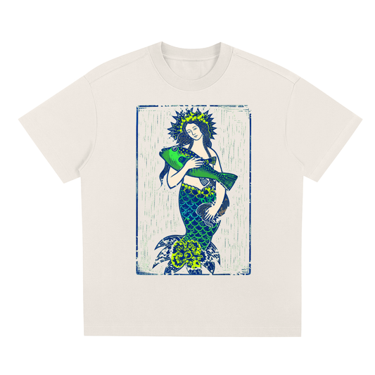 Beige Emerald Tide graphic t-shirt featuring ocean-inspired artwork influenced by coastal landscapes and natural beauty.