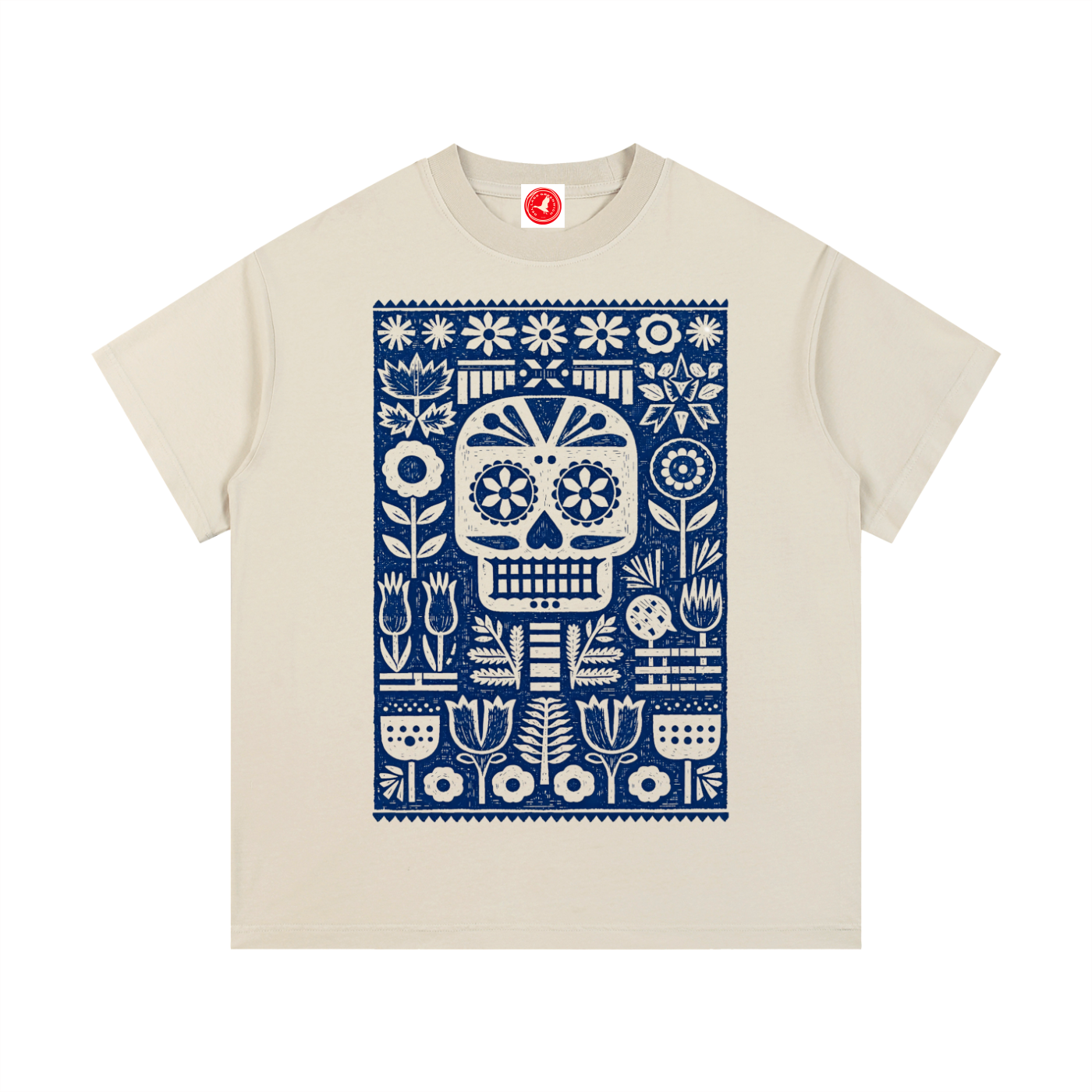 Beige t-shirt with a blue skull and floral pattern on a white background