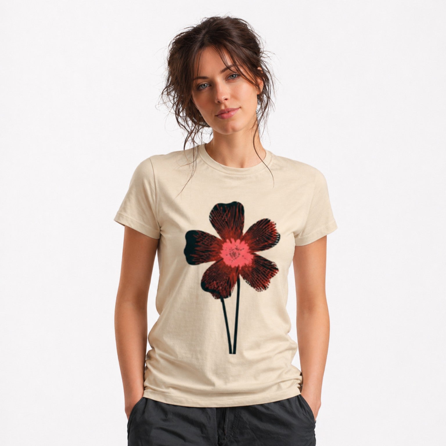 Woman wearing a beige Midnight Bloom graphic t-shirt featuring floral artwork inspired by wildflowers, moonlit gardens, and natural beauty.