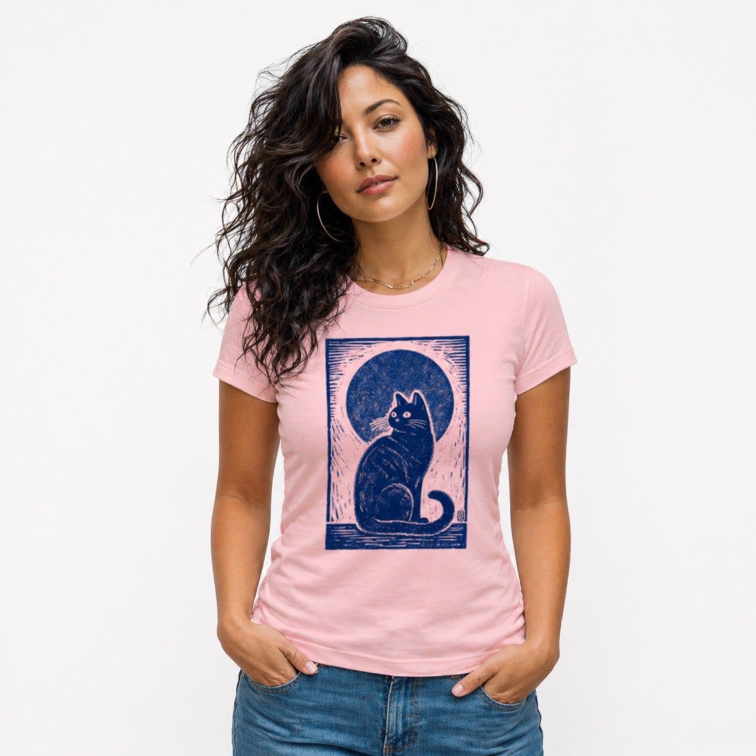 Woman wearing a pink Midnight Cat Indigo graphic t-shirt featuring artistic cat artwork inspired by moonlit evenings and feline charm.
