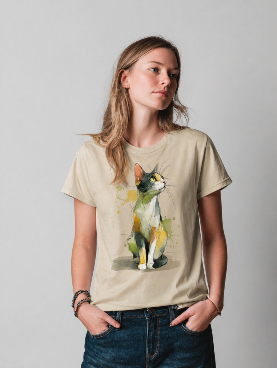 Person wearing a beigeWatercolor Cat graphic t-shirt featuring artistic cat artwork inspired by watercolor illustration and feline lovers.