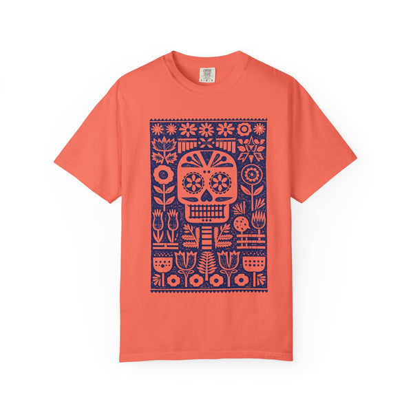Coral t-shirt with a blue skull and floral pattern on a white background