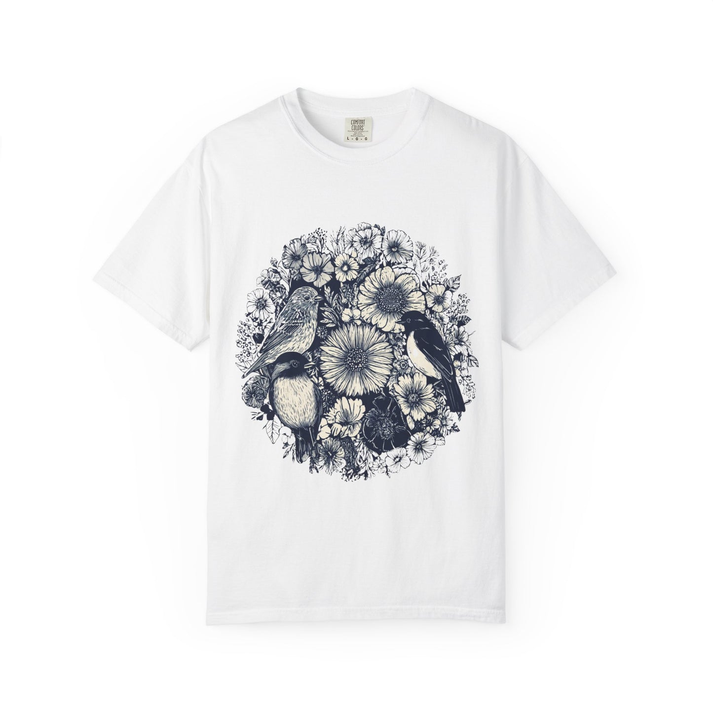 White t-shirt with black and white floral and bird design on a white background