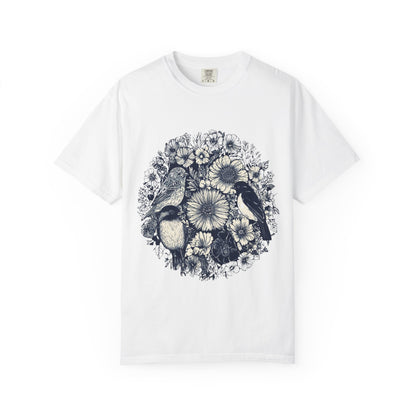 White t-shirt with black and white floral and bird design on a white background