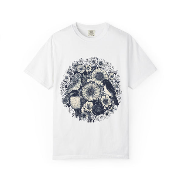 White t-shirt with black and white floral and bird design on a white background