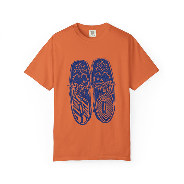 Orange t-shirt with blue graphic of sneakers on a white background