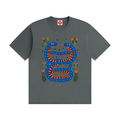 Twin Serpents boys graphic t-shirt featuring original blue and orange serpent artwork with floral accents. Soft cotton short-sleeve tee laid flat on a white background by Del Lago Greenwich.