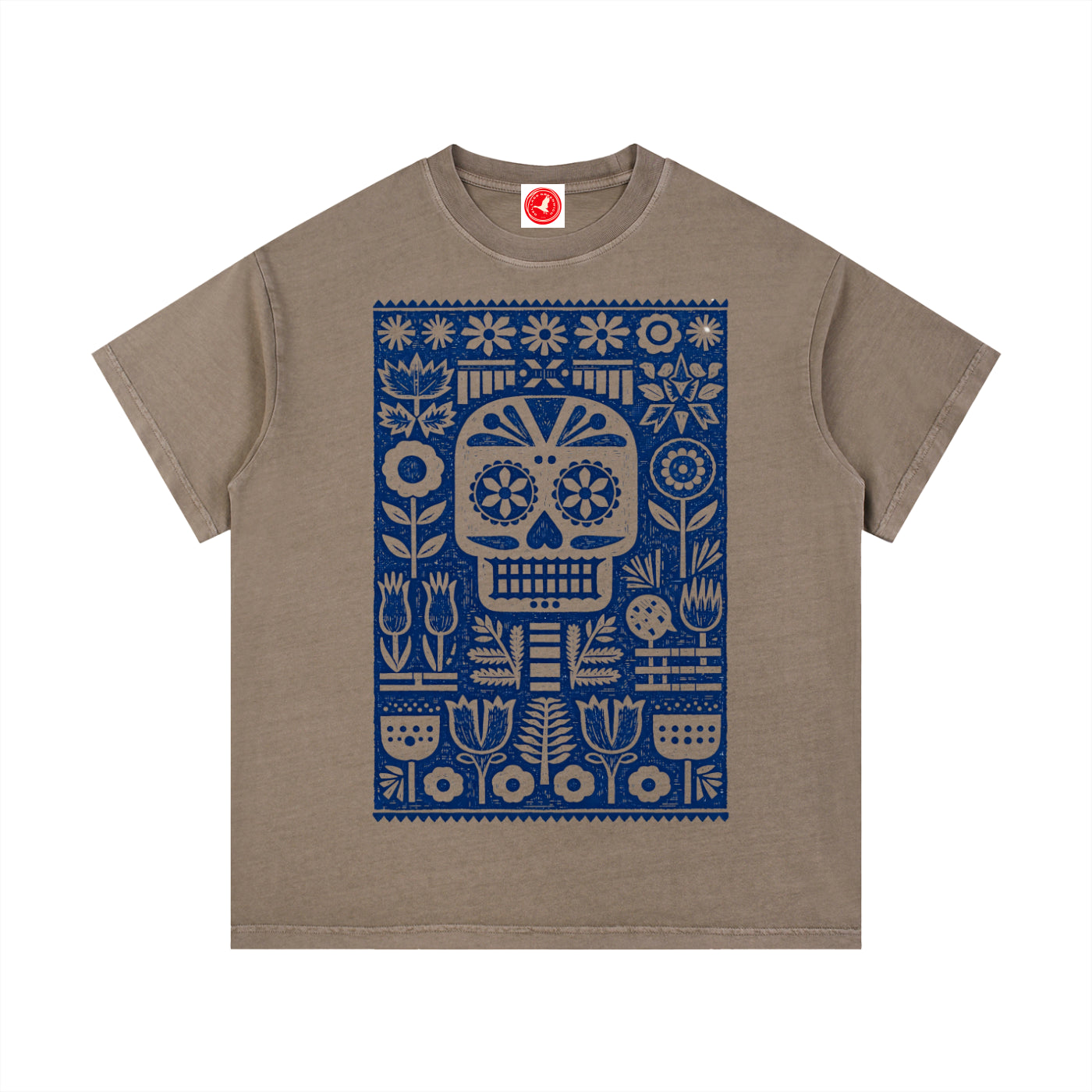 Brown Folk Skull graphic t-shirt featuring decorative skull artwork inspired by folk art and vintage illustration.