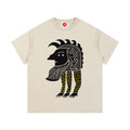 Beige Abstract Folk Creature graphic t-shirt featuring artistic folk-inspired creature artwork and imaginative storytelling design.