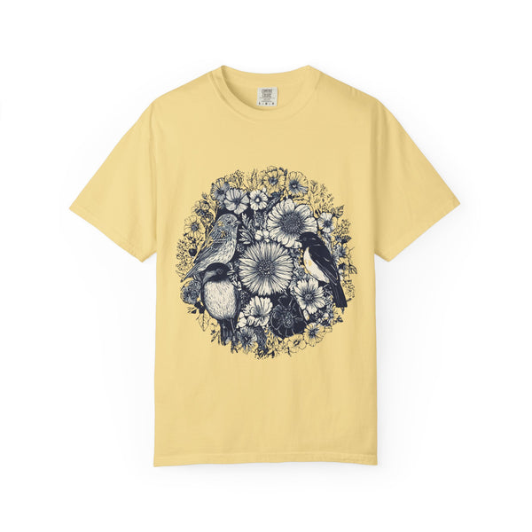 Yellow t-shirt with floral and bird design on a white background