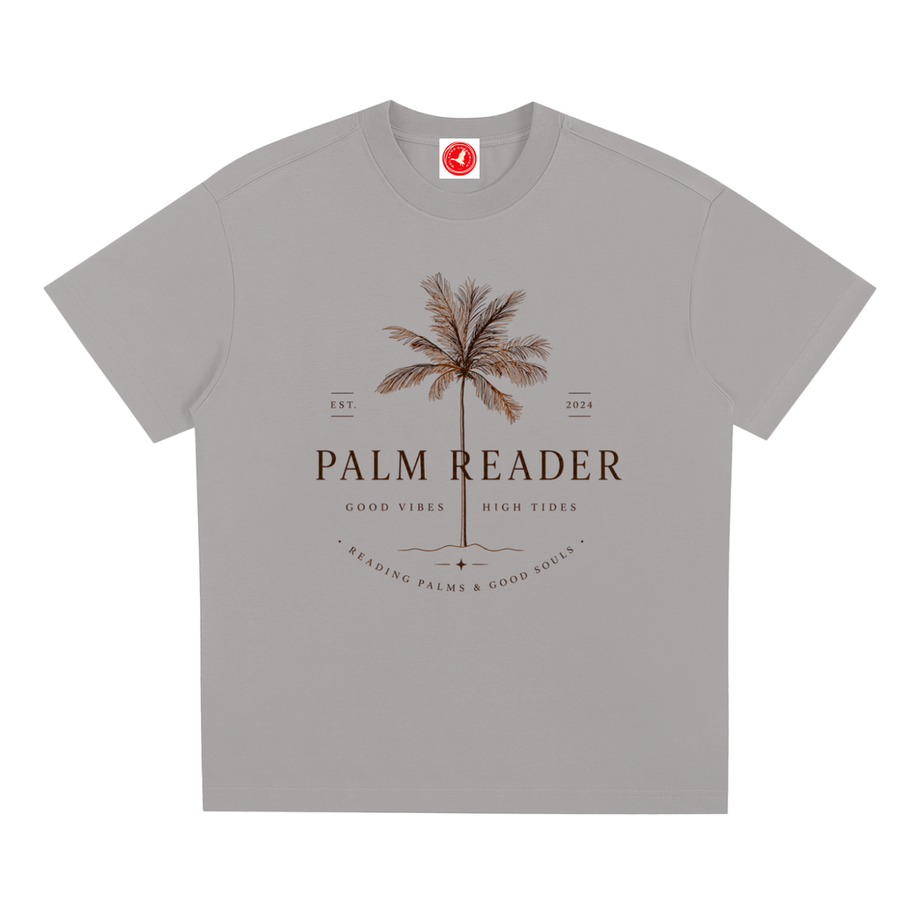 Gray Coastal graphic t-shirt featuring palm-themed artwork inspired by beach life, sunshine, and tropical escapes.