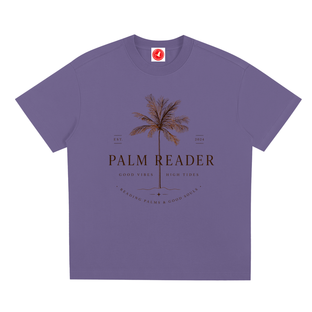 Purple Coastal graphic t-shirt featuring palm-themed artwork inspired by beach life, sunshine, and tropical escapes.