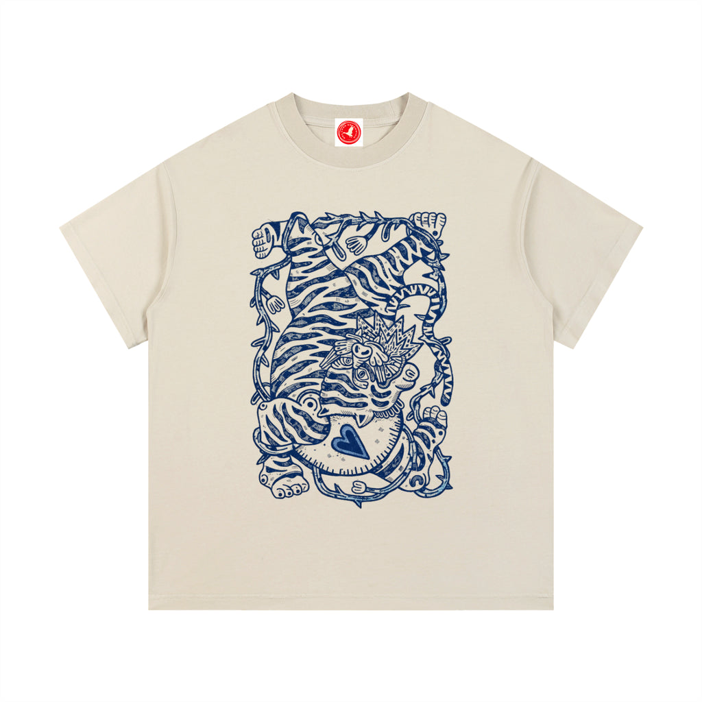 Beige tInk Tiger graphic t-shirt featuring bold tiger artwork inspired by wildlife and traditional ink illustration.