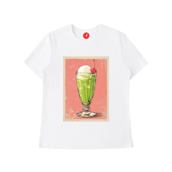 White t-shirt with a graphic of a green milkshake and ice cream on a pink background.