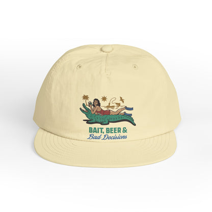 Beige surfer cap featuring a retro beach graphic with tropical artwork and vintage-inspired design.