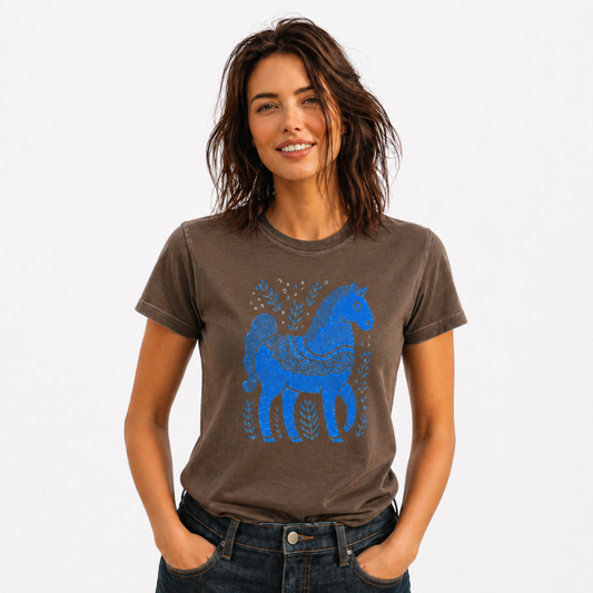 Woman wearing a brown t-shirt with a blue horse graphic on a white background