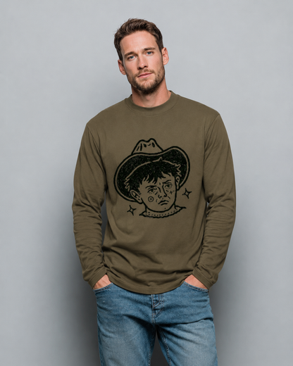 Man wearing a green long-sleeve shirt with a graphic design on a gray background