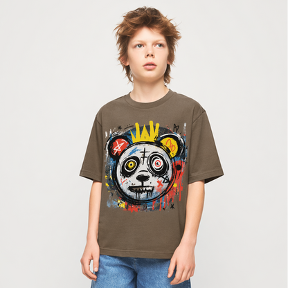Child wearing a graphic t-shirt and denim shorts on a plain background