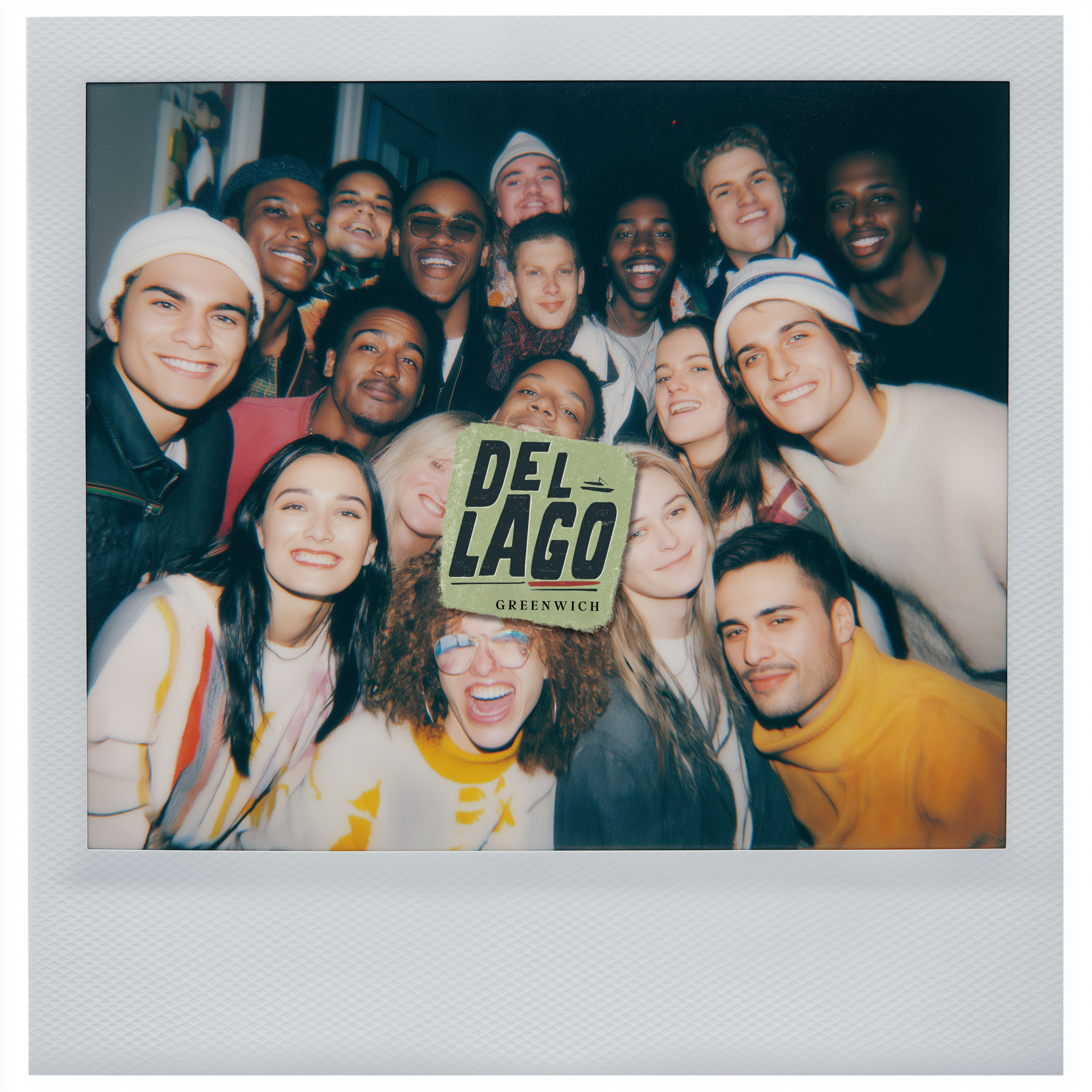 Group of people posing together with a 'Del Lago' sign in the center.