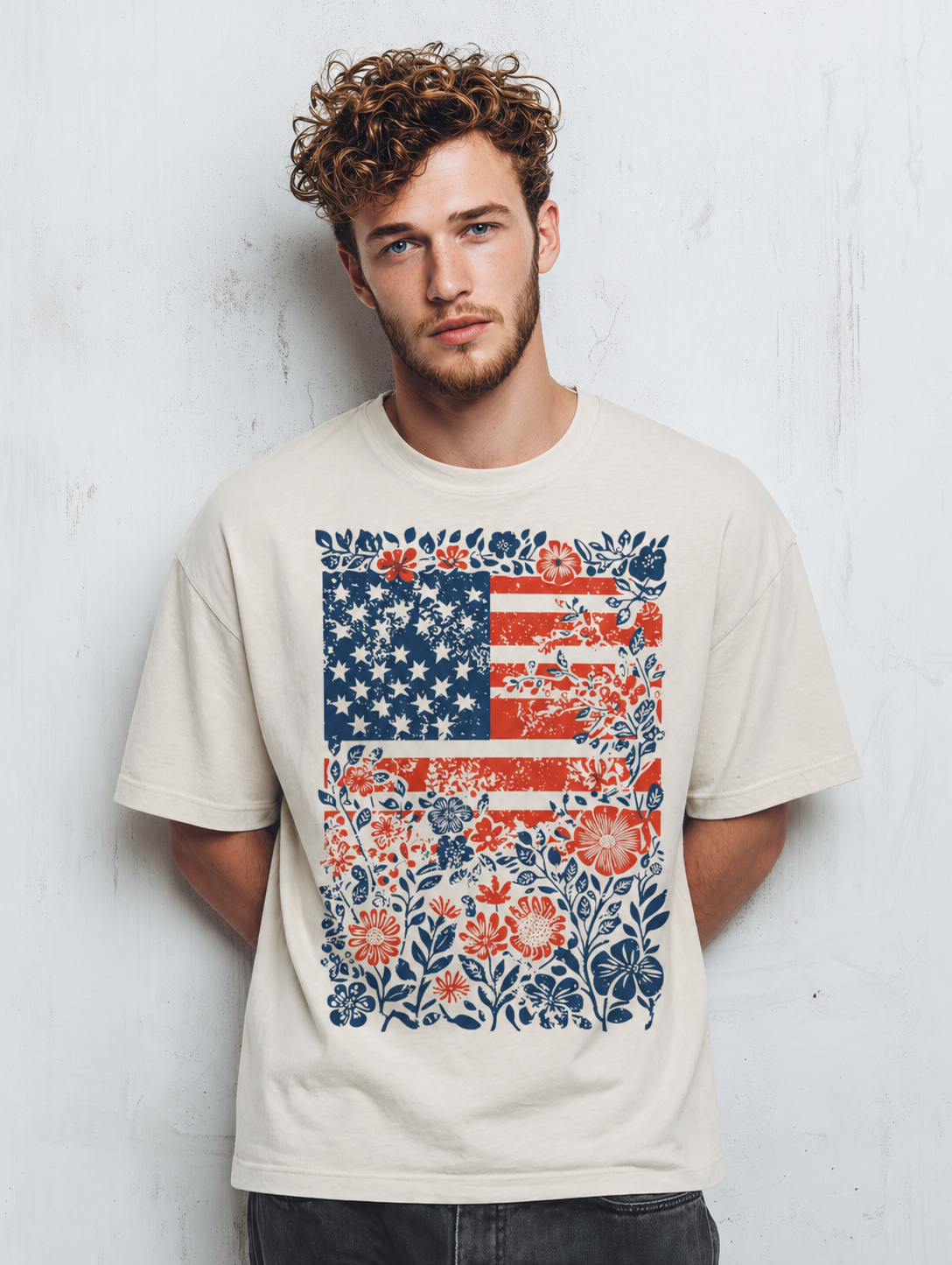 Man wearing a t-shirt with a floral American flag design against a white background
