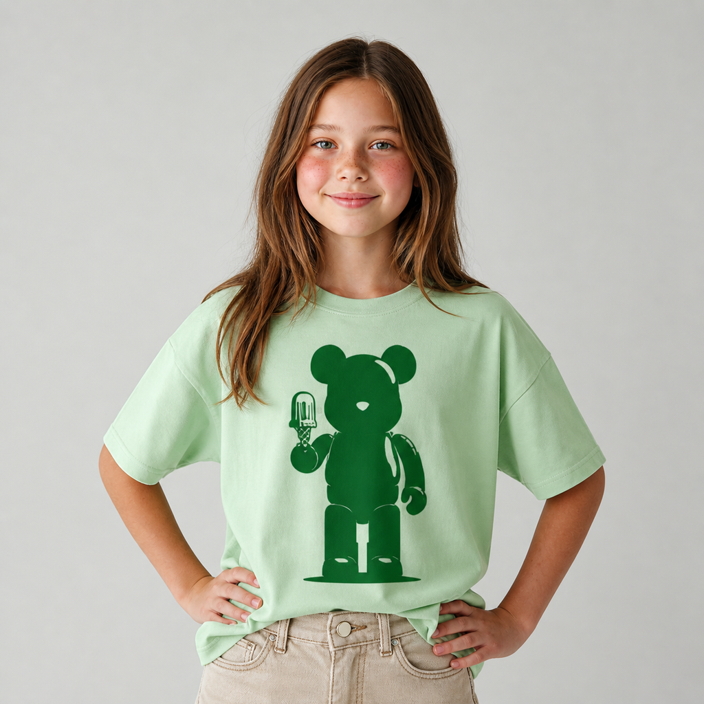 Model wearing the Green Teddy Ice Cream graphic t-shirt featuring whimsical artwork inspired by fun and imagination.