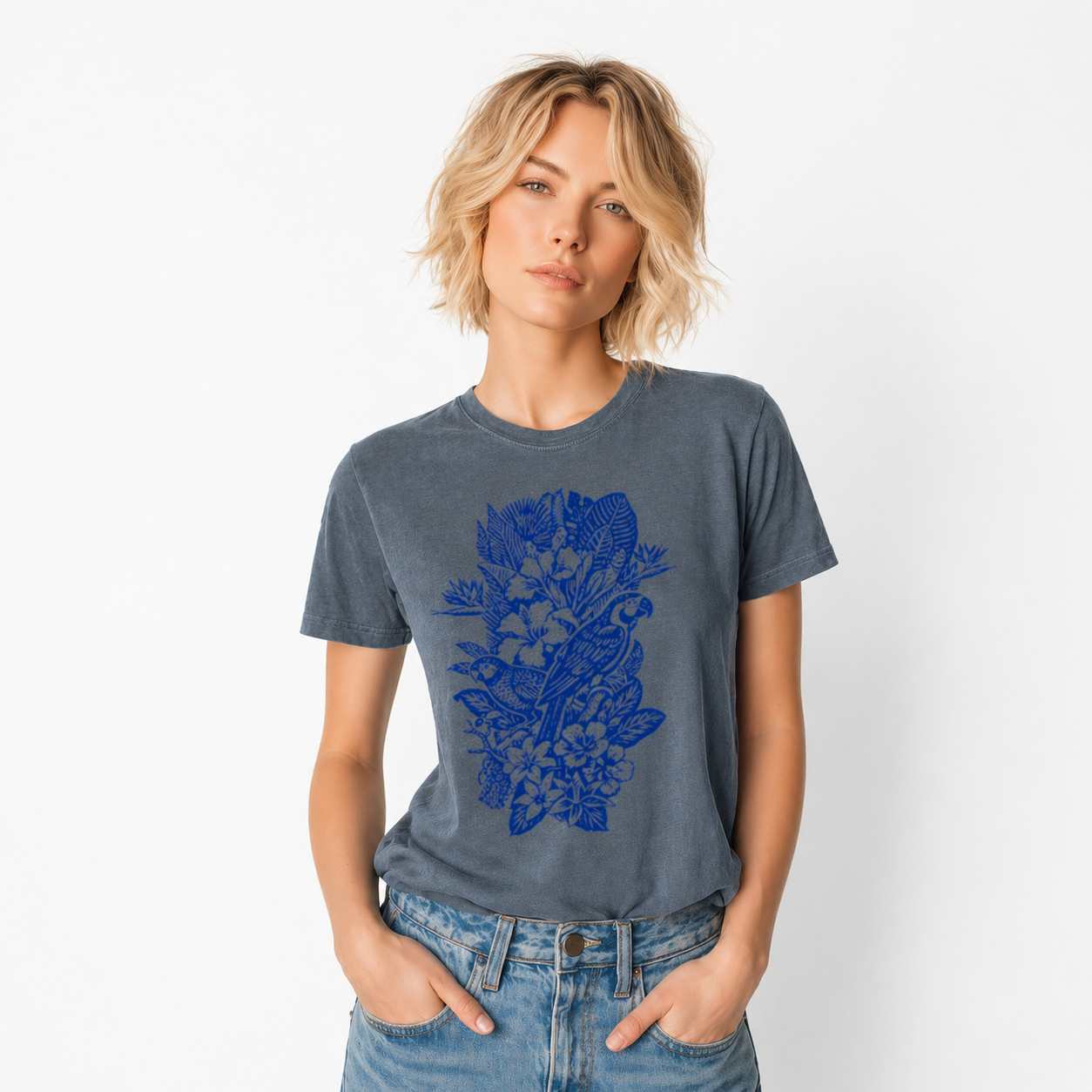 Woman wearing a blue t-shirt with a floral design on a white background