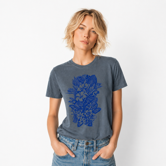 Woman wearing a blue t-shirt with a floral design on a white background