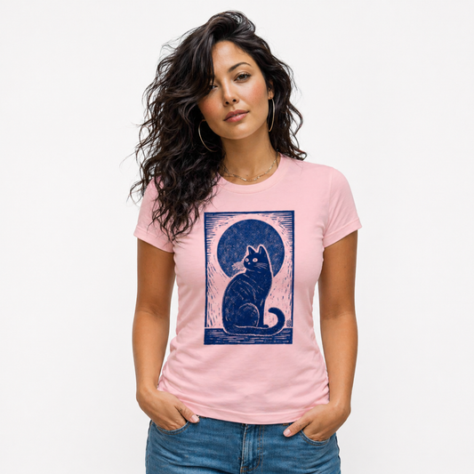 Woman wearing a pink t-shirt with a blue cat graphic on a white background
