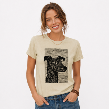 Woman wearing a beige t-shirt with a black and white dog graphic on a plain background