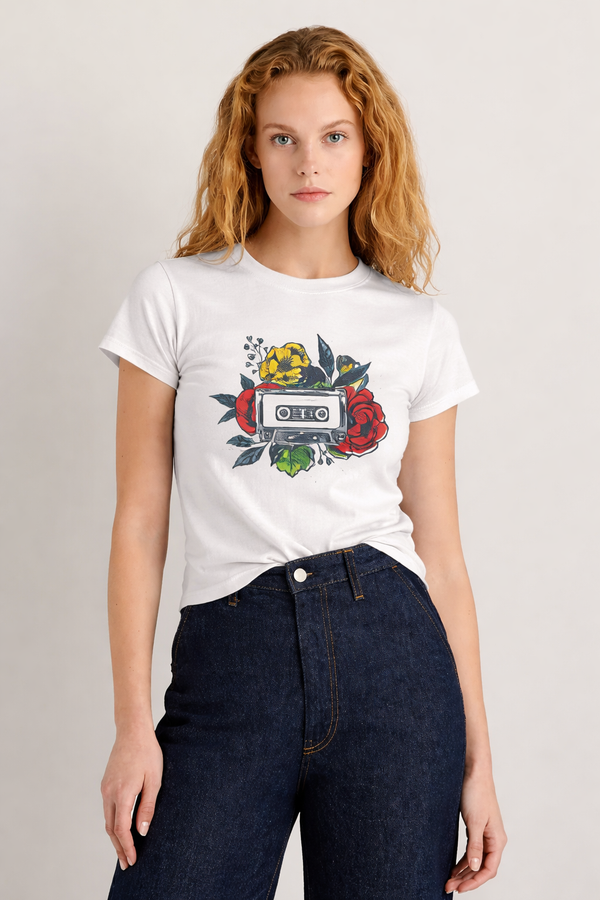 Person wearing a white t-shirt with a graphic design on a plain background