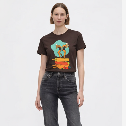 Person wearing a graphic t-shirt and dark jeans on a white background