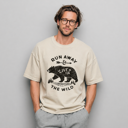 Man wearing a beige t-shirt with a bear graphic and text against a gray background