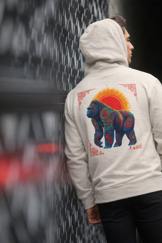 Person wearing a hoodie with a colorful bear design on the back, standing against a blurred background.