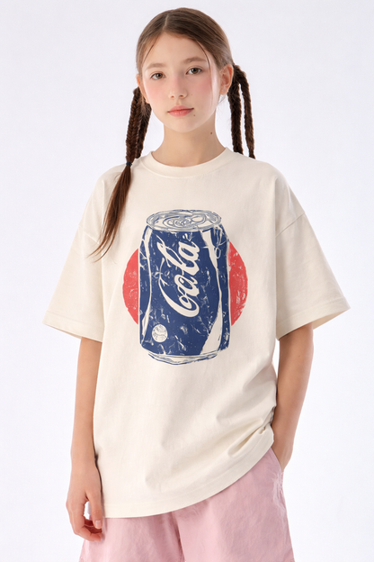 Person wearing a white t-shirt with a Coca-Cola graphic on a plain background