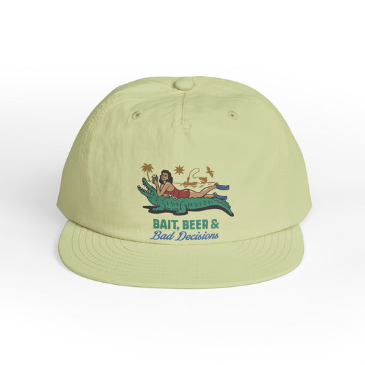 White surfer cap featuring a retro beach graphic with tropical artwork and vintage-inspired design.