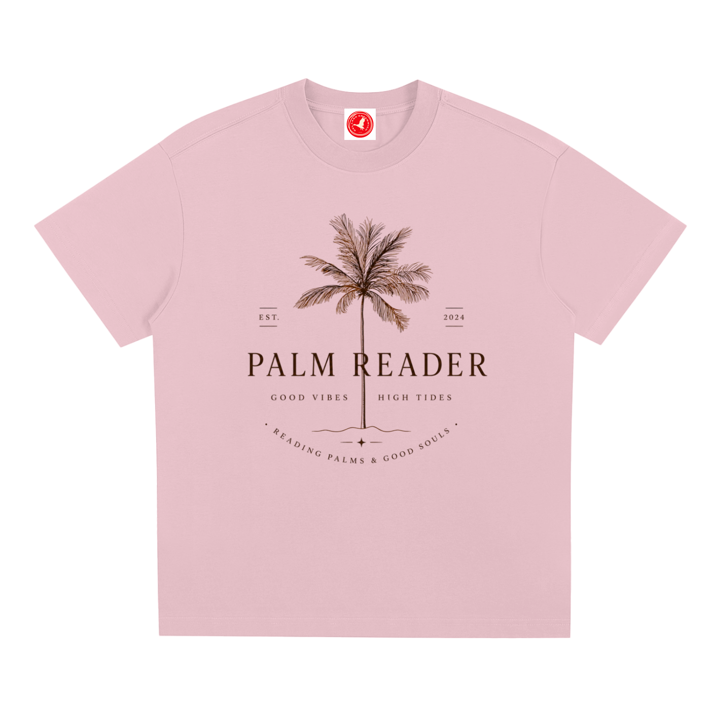 Pink Coastal graphic t-shirt featuring palm-themed artwork inspired by beach life, sunshine, and tropical escapes.