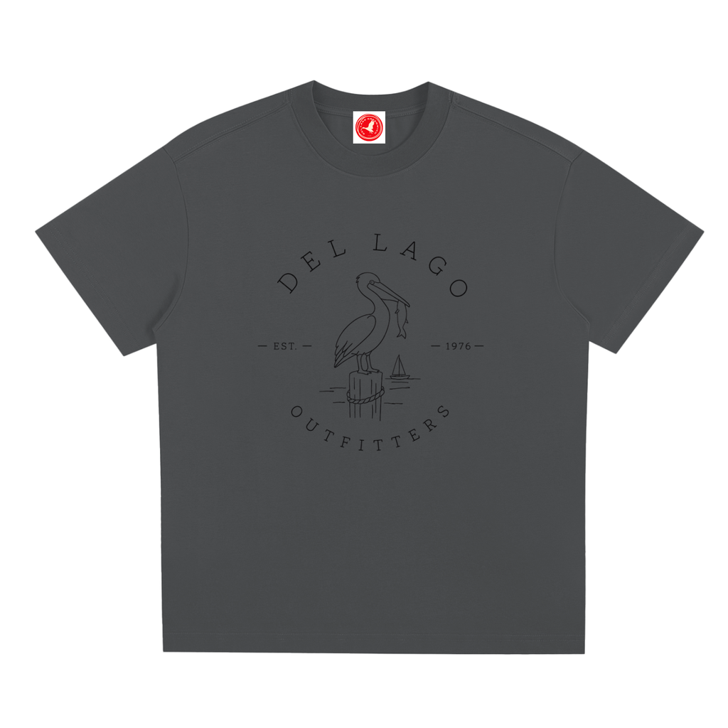 Black Pelican graphic t-shirt featuring original coastal bird artwork inspired by beach living and nature.