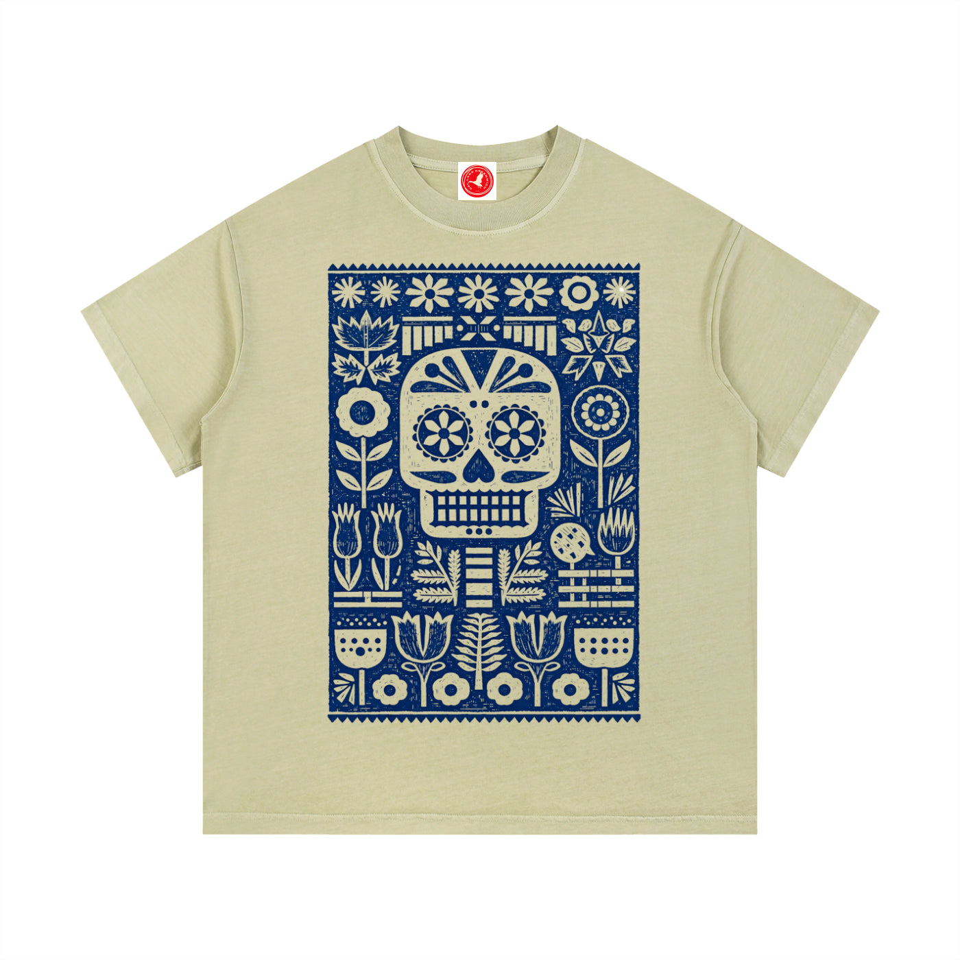 Beige Folk Skull graphic t-shirt featuring decorative skull artwork inspired by folk art and vintage illustration.
