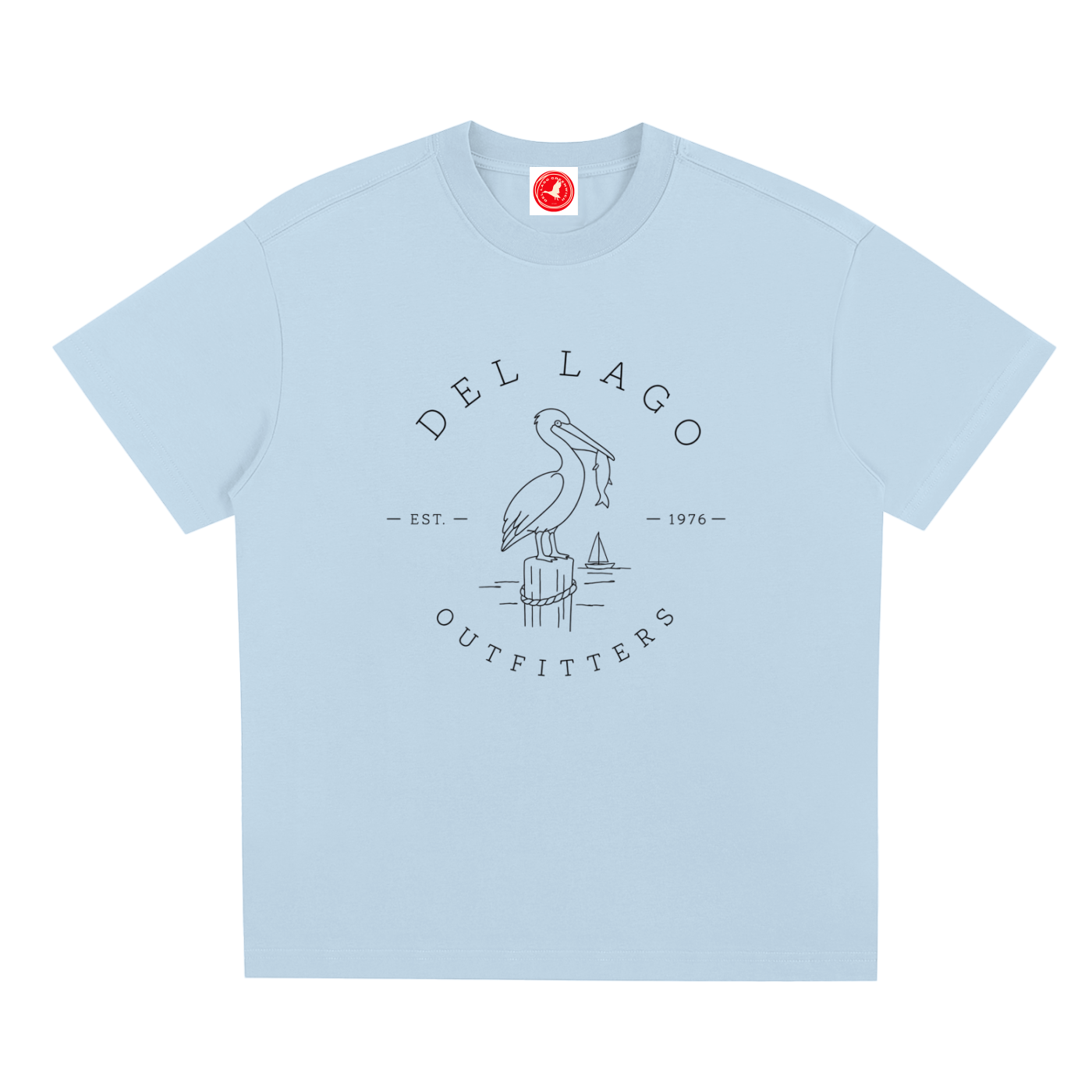 Light blue Pelican graphic t-shirt featuring original coastal bird artwork inspired by beach living and nature.