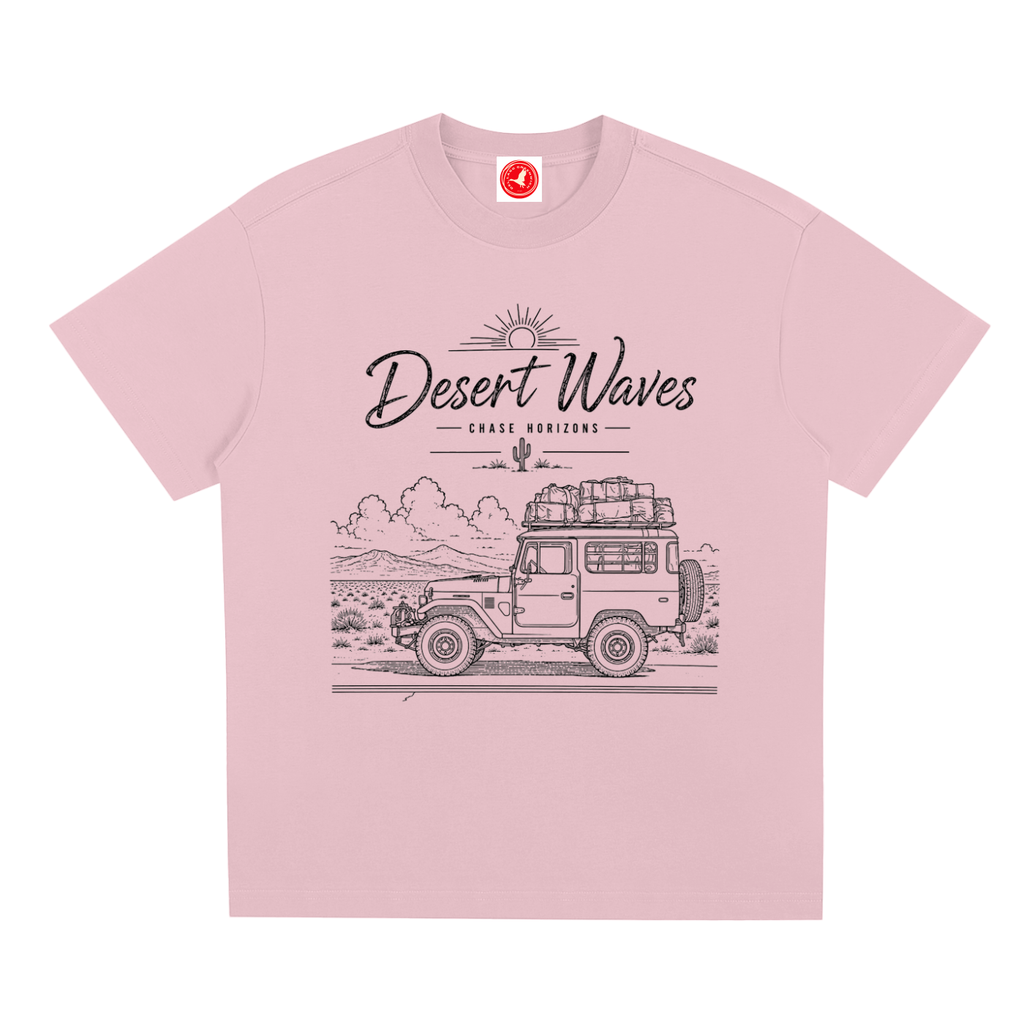 Pink Desert-inspired graphic t-shirt featuring artistic landscape artwork blending desert scenery with coastal influences.