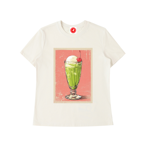 White t-shirt with a graphic of a green milkshake and ice cream on a pink background