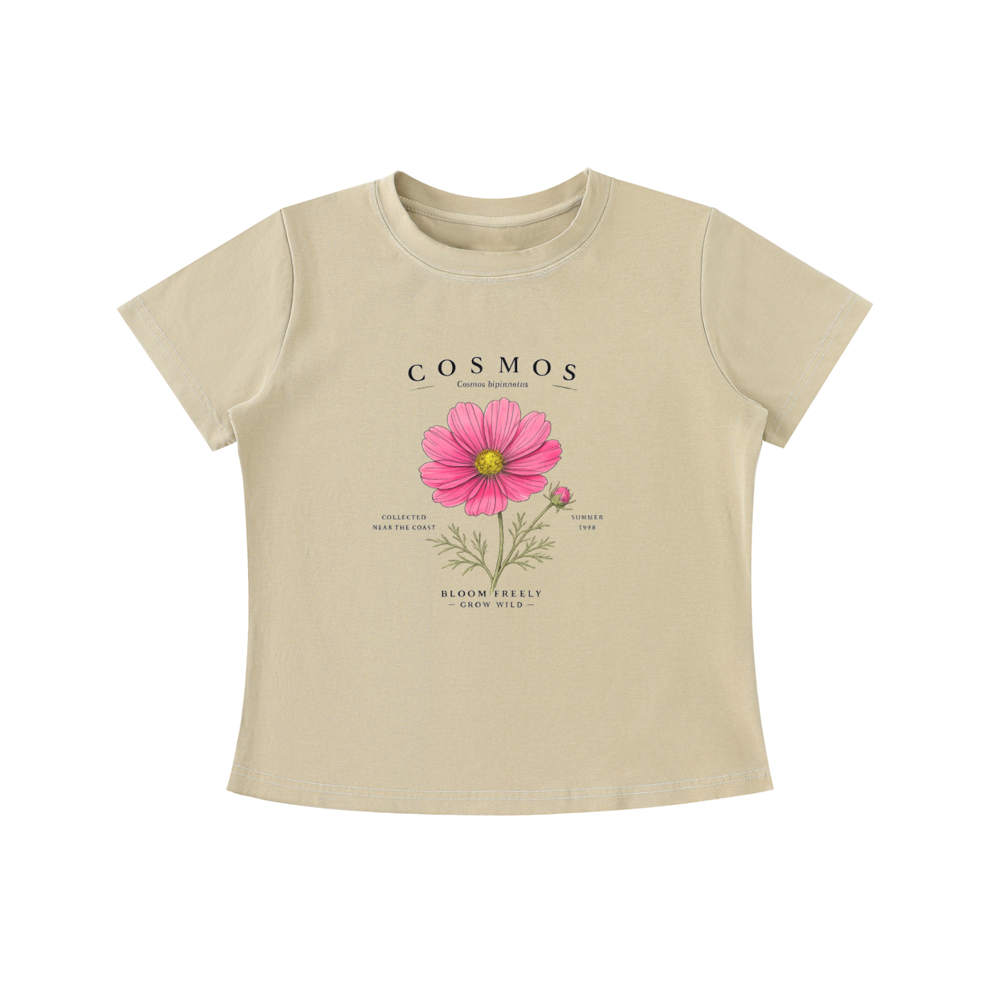 Beige Cosmos Bloom Freely graphic t-shirt featuring floral artwork inspired by wildflowers, growth, and natural beauty.