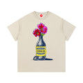 Beige Cerveza Bloom Bottle graphic t-shirt featuring floral bottle artwork inspired by vintage design and botanical illustration.
