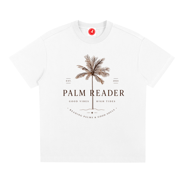White Coastal graphic t-shirt featuring palm-themed artwork inspired by beach life, sunshine, and tropical escapes.