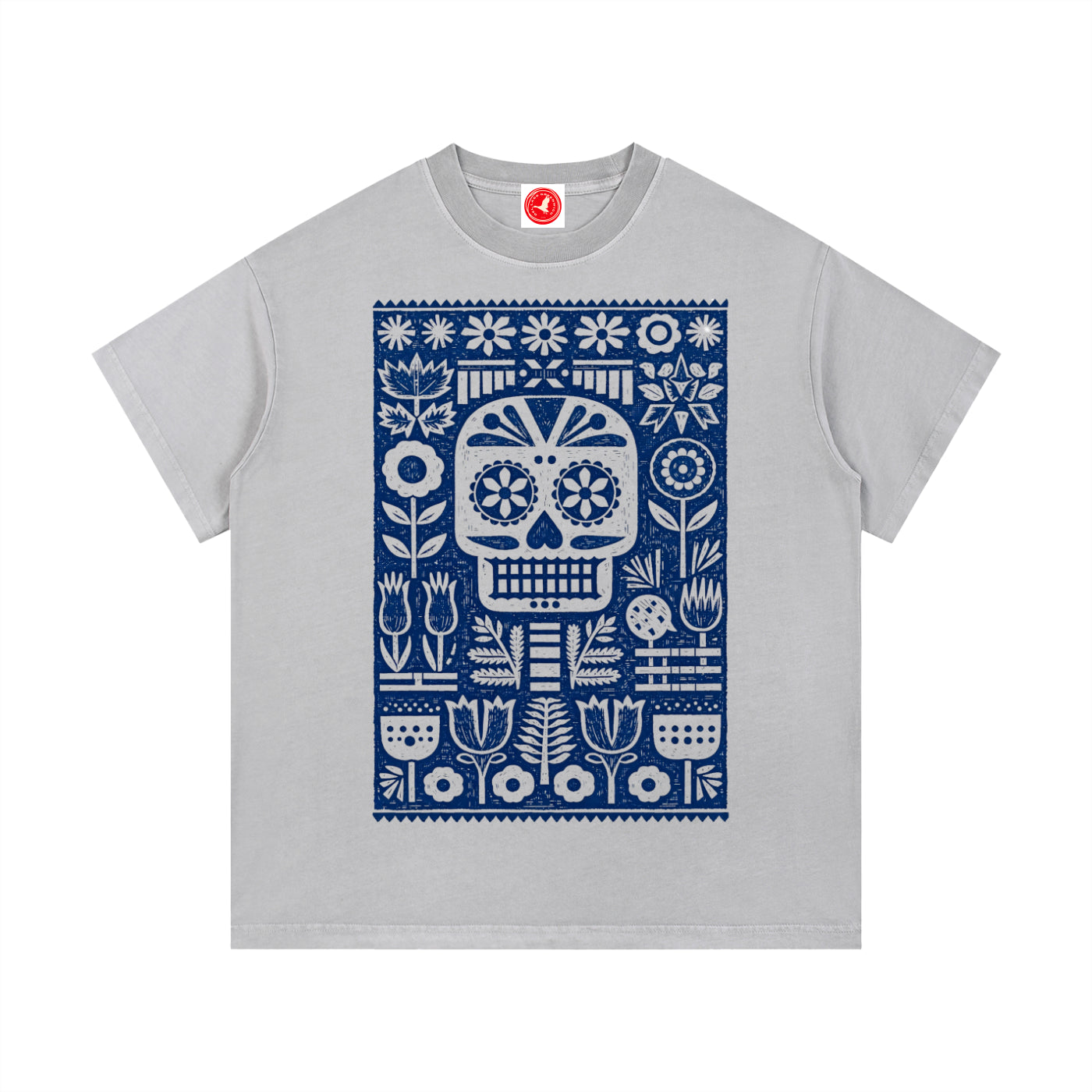 Gray Folk Skull graphic t-shirt featuring decorative skull artwork inspired by folk art and vintage illustration.