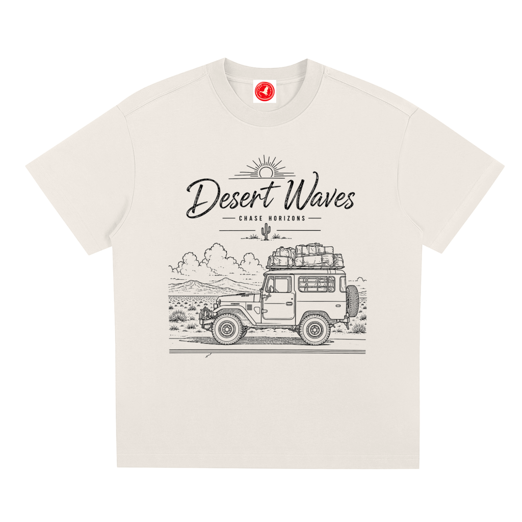 Desert-inspired graphic t-shirt featuring artistic landscape artwork blending desert scenery with coastal influences.