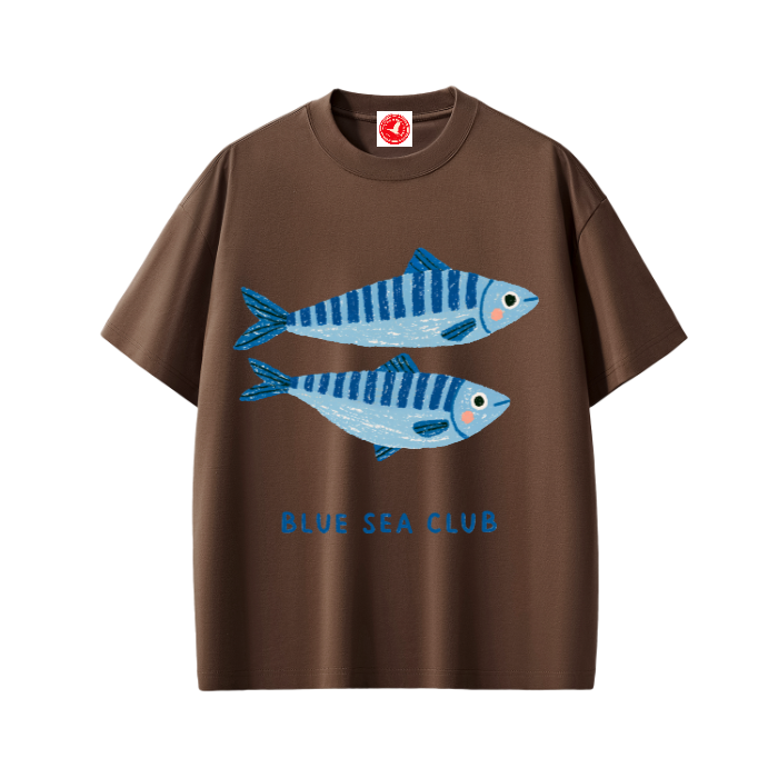Brown Blue Sea Club graphic t-shirt featuring coastal-inspired artwork celebrating ocean adventures and seaside living.