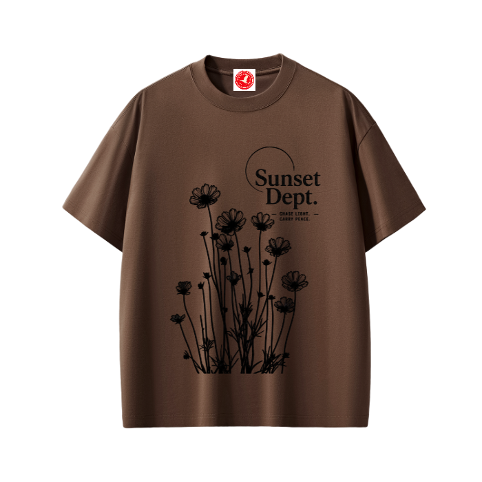 Brown Graphic t-shirt featuring sunset-inspired artwork celebrating relaxed coastal living and everyday adventure.